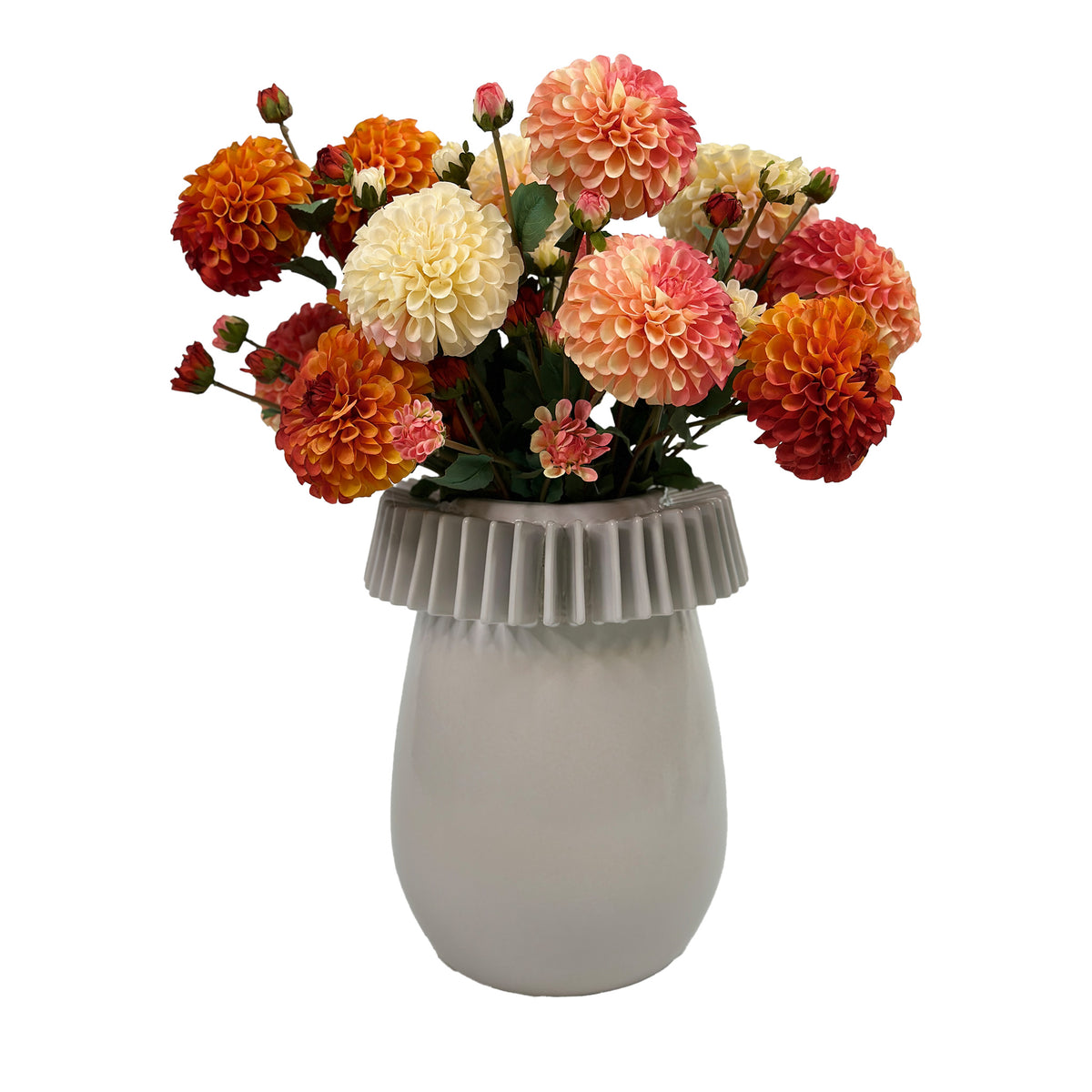 a mix of pom-pom Dahlias in vibrant and warm colours in a ceramic pot