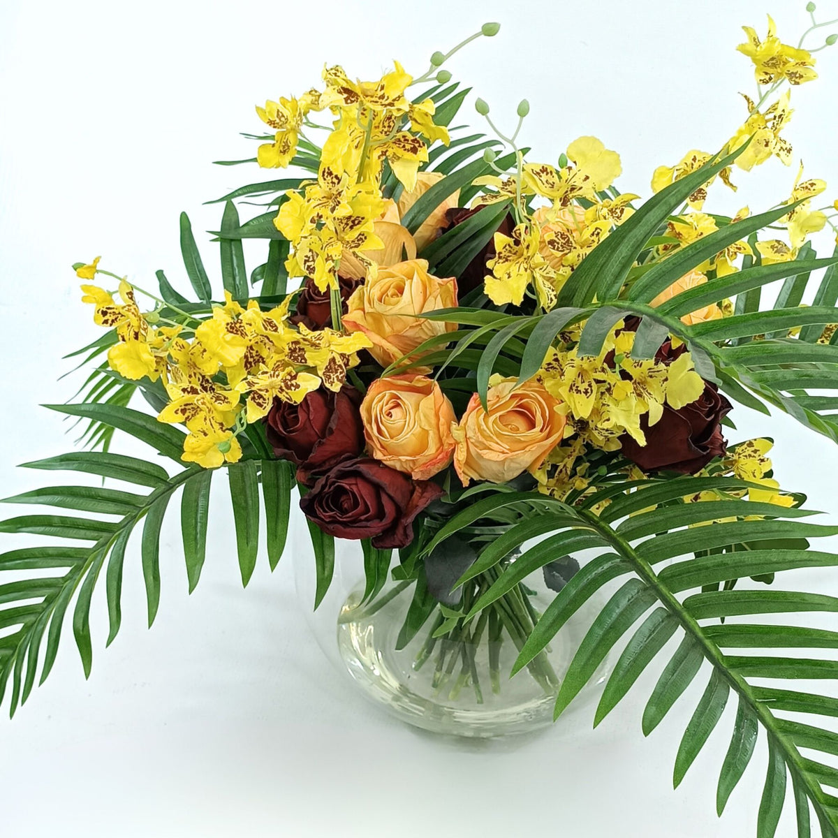 Roses Orchids and Palm Leaves Mix Arrangement