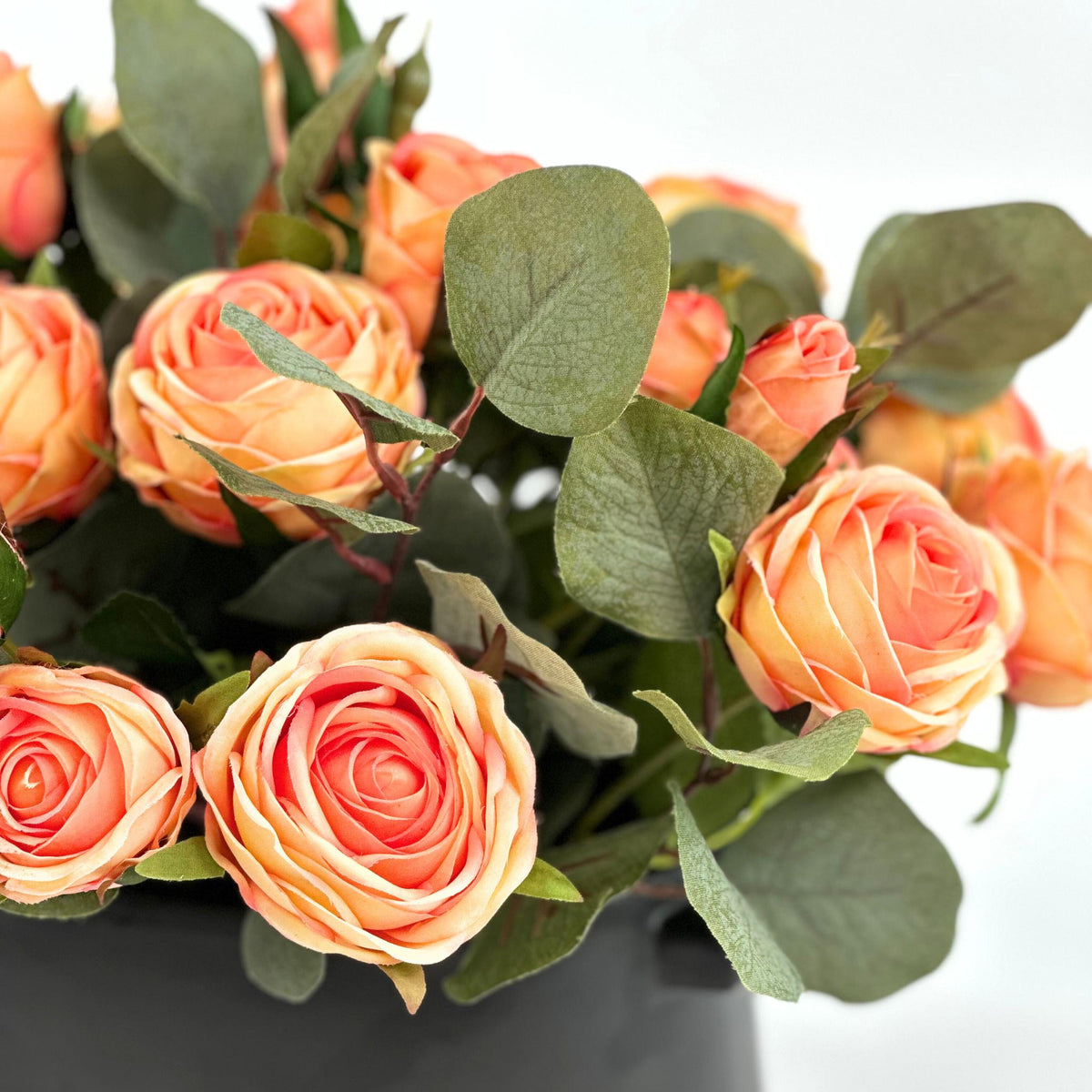 Roses Peach Silk Flower Arrangement in Black Ceramic Planter. Full close up view. Available from www.plantcouture.co.za