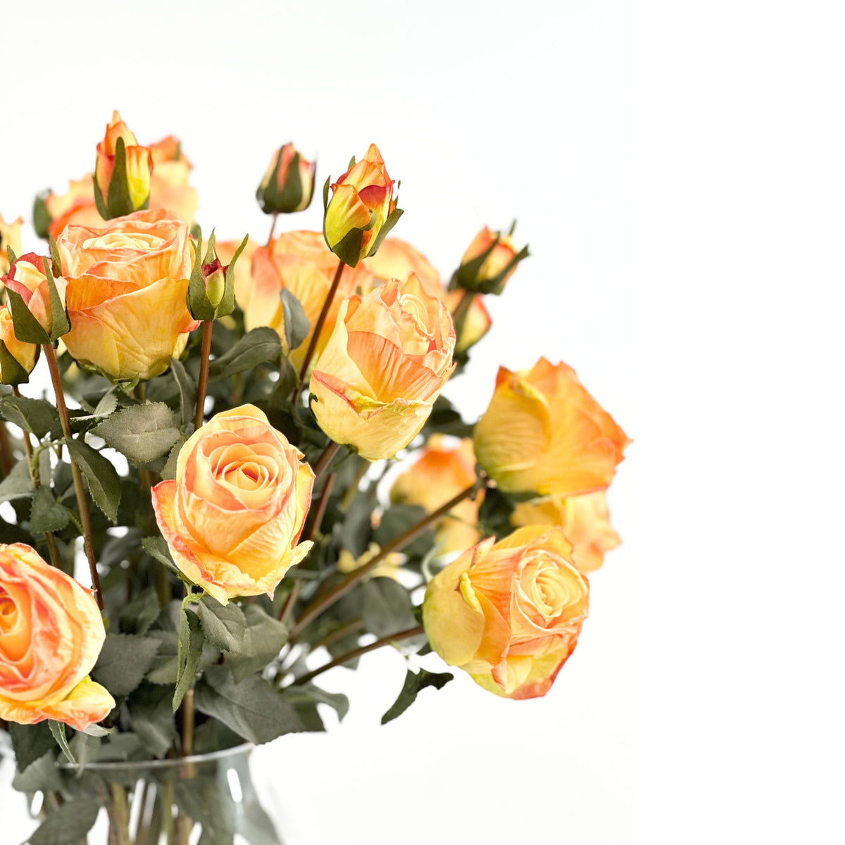 Roses Orange Silk Flower Arrangement in Pyramid Glass Vase. Close up view. Plant Couture.