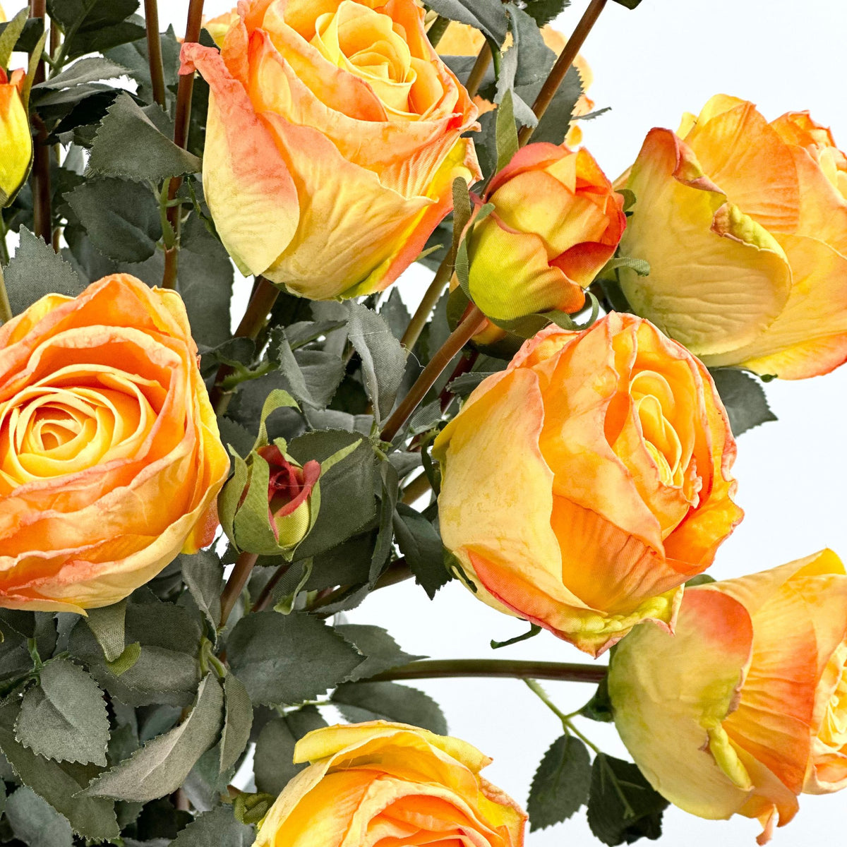 Roses Orange Silk Flower Arrangement in Pyramid Glass Vase. Close up view. Plant Couture.